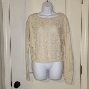 Off white colored sweater.